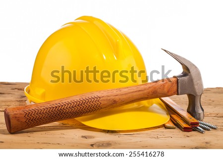 yellow helmet and wood mounting tools on wooden table