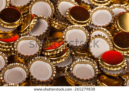 golden bottle caps on table