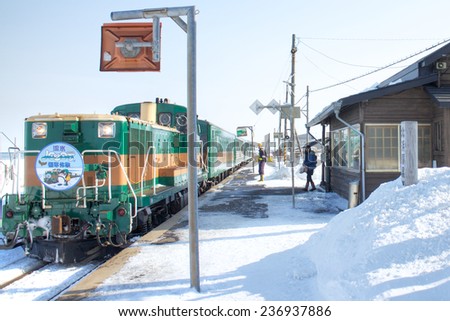 HOKKAIDO, JAPAN-FEB. 1, 2013: The bus is reaching station at a big snow day at Hokkaido, Japan. Hokkaido in the most northern main island in Japan.