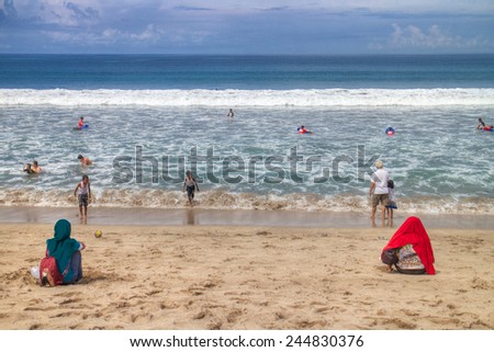 YOGYAKARTA, INDONESIA-DEC. 23, 2014: People enjoy the beach at Yogyakarta, Indonesia. A beach face to Indian ocean.