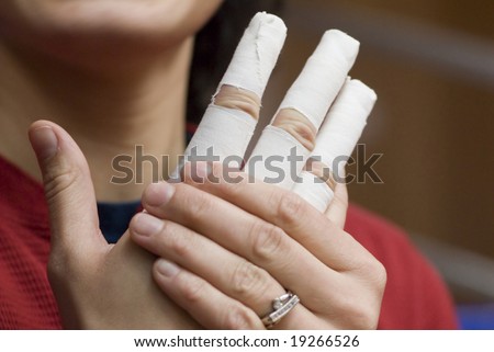 textile sticking plaster on three fingers