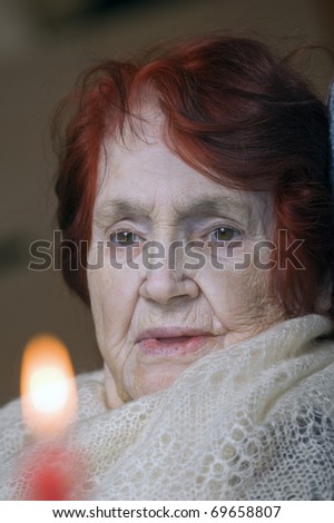 Portrait of sad elderly lady