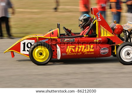 KUALA LUMPUR - JULY 1: Unidentified  driver in a racing car model competes at Educational Innovation of Motor sports & Automotive Race 2011 in Kuala Lumpur, Malaysia on July 1, 2011.