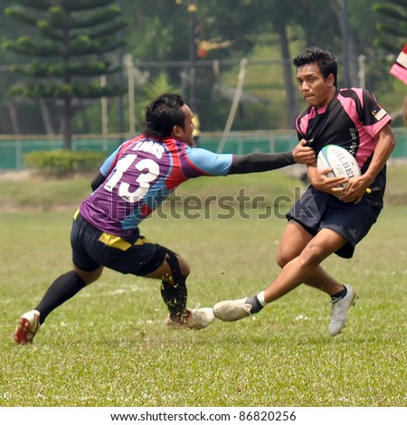 MALAYSIA - OCTOBER 15: Unidentified participants in action during a 10s Rugby Tournament Vice-Chancellor Cup at National Defense University Of Malaysia, Kuala Lumpur, Malaysia on October 15, 2011.