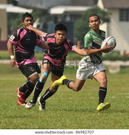 KUALA LUMPUR, MALAYSIA - OCTOBER 15: Unidentified participants in action during a 10s Rugby Tournament Vice-Chancellor Cup at National Defense University Of Malaysia, Kuala Lumpur, Malaysia on October 15, 2011.