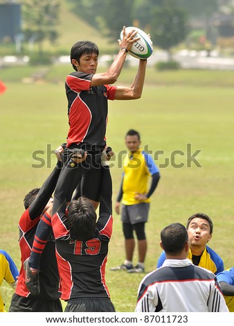 KUALA LUMPUR, MALAYSIA - OCTOBER 15: Unidentified participants in action during a 10s Rugby Vice-Chancellor Cup at National Defense University Of Malaysia, Kuala Lumpur, Malaysia on October 15, 2011.