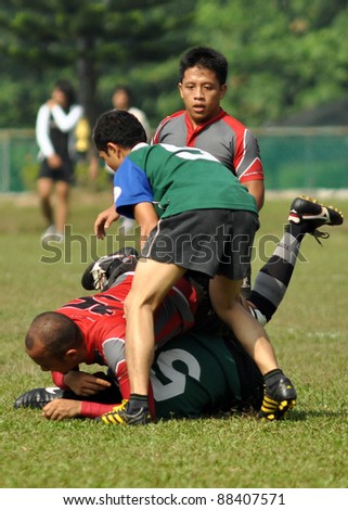 KUALA LUMPUR - OCT. 15: Unidentified players in action during Rugby 10s Tournament Vice-Chancellor Cup at National Defense University Of Malaysia on October 15, 2011 in Kuala Lumpur, Malaysia.