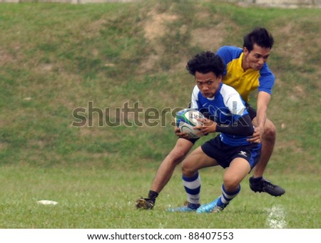 KUALA LUMPUR - OCT. 15: Unidentified players in action during Rugby 10s Tournament Vice-Chancellor Cup at National Defense University Of Malaysia on October 15, 2011 in Kuala Lumpur, Malaysia.