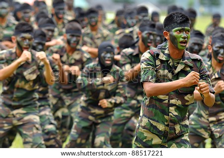 KUALA LUMPUR, MALAYSIA - SEPT. 30: Unidentified army student performs war dance at Convocation Festival at National Defense University Of Malaysia, Kuala Lumpur, Malaysia on September 30, 2011.