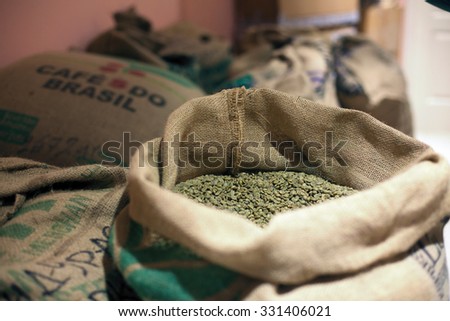 Khabarovsk, RUSSIA - JULY 27, 2013: Green coffee beans in a sack at coffee roasters storage