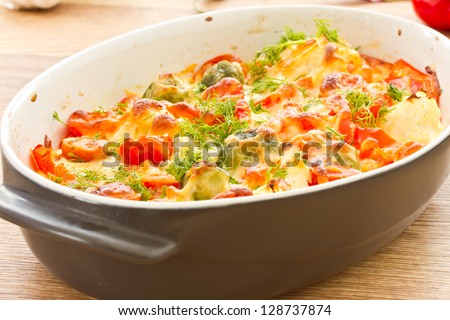 different vegetables baked with cheese in the oven