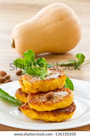 sweet pumpkin pancakes on a plate with mint