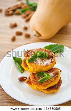 sweet pumpkin pancakes on a plate with mint