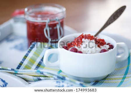 rice porridge with jam and berries in a plate