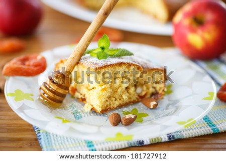 sponge cake with dried apricots, almonds and fruit