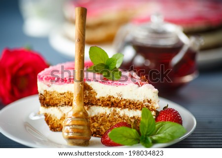 Honey cake with strawberries decorated with mint