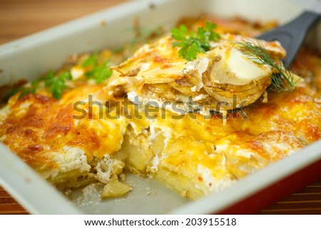 new potatoes baked with cheese in baking dish
