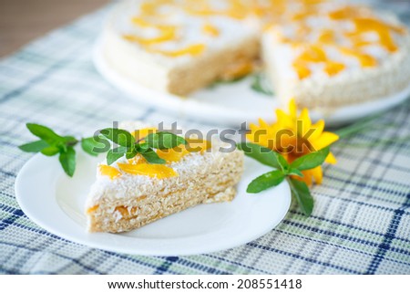 Waffle cake with peaches and cream decorated with mint