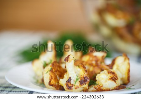 cauliflower fried in batter on a plate