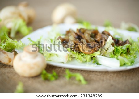 warm salad with fried mushrooms and lettuce