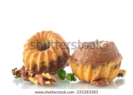 sweet walnut muffins from two types of dough on a white background