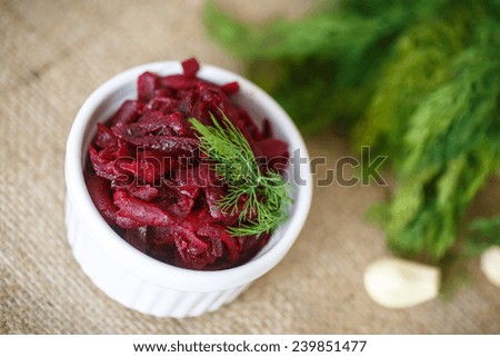 beet salad with garlic on a white plate