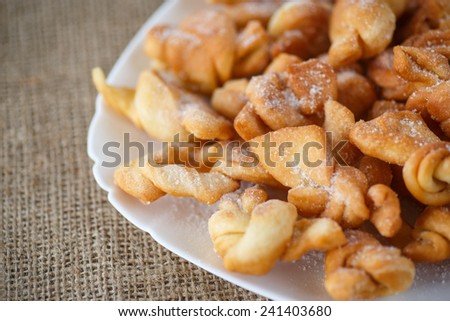 sweet pastry deep fried and sprinkled with powdered sugar