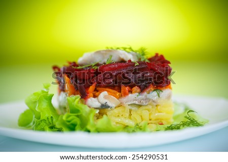 Russian traditional salad with herring and boiled vegetables