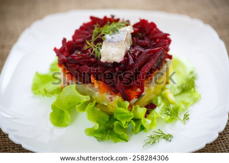 Russian traditional salad with herring and boiled vegetables