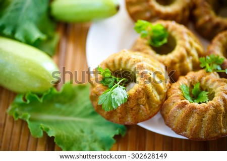 cooked squash cakes with parsley on a plate