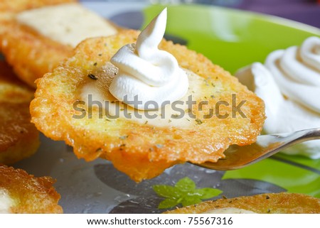 potato pancakes with cheese and sour cream