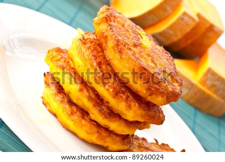 roasted pumpkin pancakes pumpkin pieces on the background