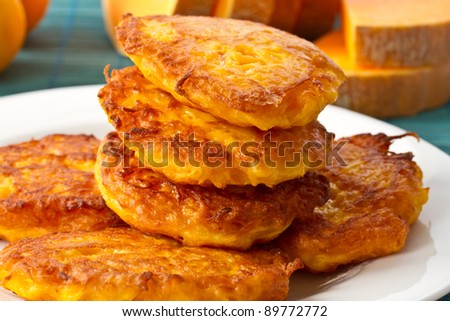roasted pumpkin pancakes pumpkin pieces on the background