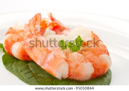 large cooked shrimp on a plate on a white background