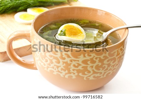 green soup of sorrel soup in a cup