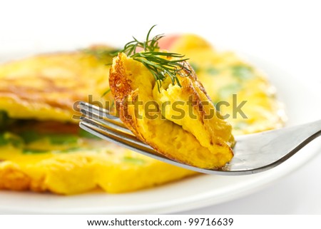 scrambled eggs with fresh herbs on a white background