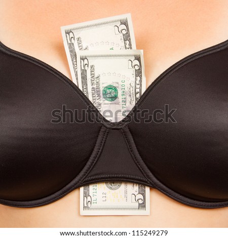 Concept - woman with cash in a bra (10 dollar)