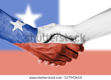 Man and woman shaking hands, wrapped in flag pattern, Chile