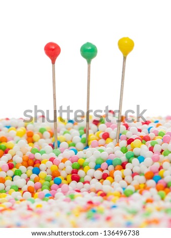 Straight pins in candy, concept of deception