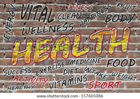 Health word cloud painted with grafitti on a brick wall