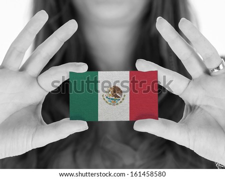 Woman showing a business card, black and white, Mexico