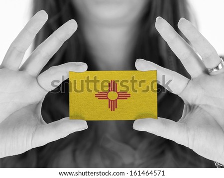 Woman showing a business card, black and white, New Mexico