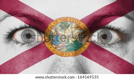 Close up of eyes. Painted face with flag of Florida