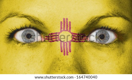 Close up of eyes. Painted face with flag of New Mexico