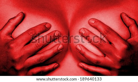 Upper part of female body, hands covering breasts, red