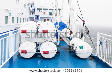 Lifeboats (barrel) by deck of a cruise ship