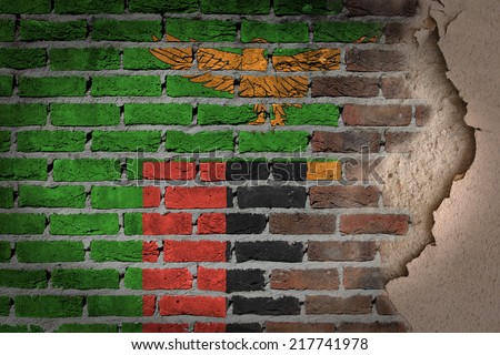 Dark brick wall texture with plaster - flag painted on wall - Zambia