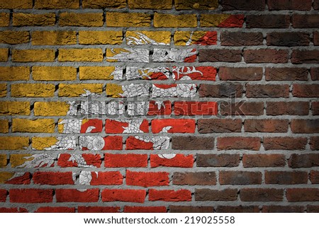 Dark brick wall texture - flag painted on wall - Bhutan