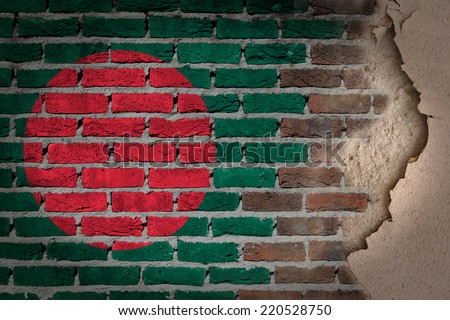 Dark brick wall texture with plaster - flag painted on wall - Bangladesh
