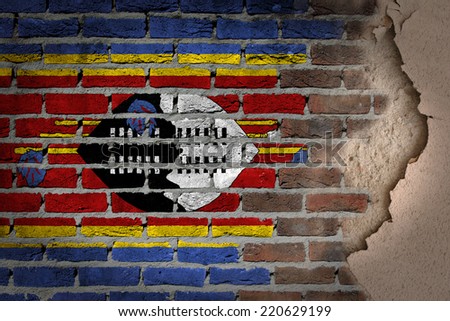 Dark brick wall texture with plaster - flag painted on wall - Swaziland